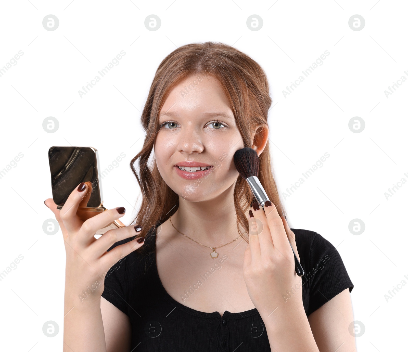 Photo of Smiling teenage girl applying blusher with makeup brush on white background