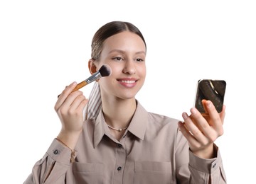 Photo of Smiling teenage girl applying blusher with makeup brush on white background