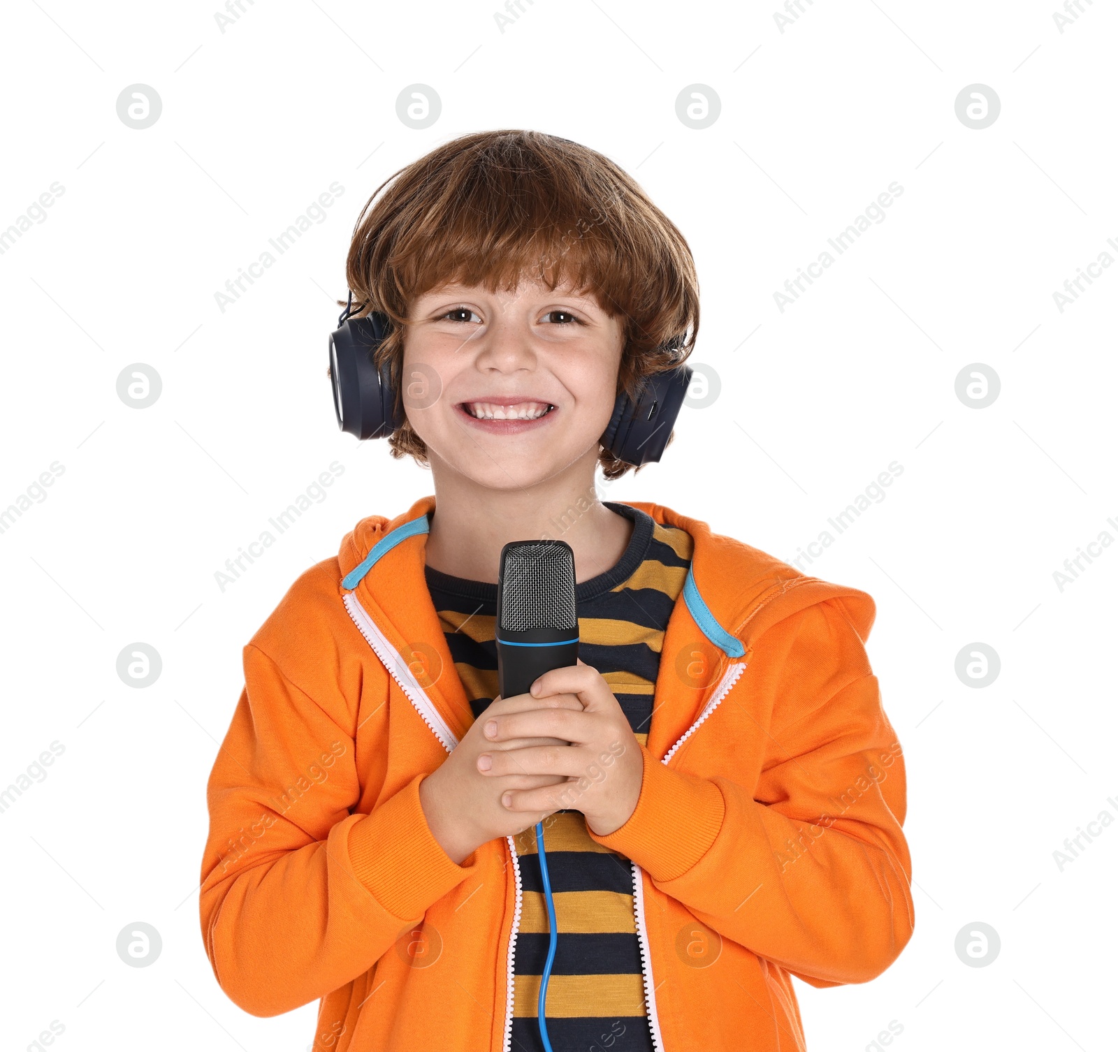 Photo of Little boy with microphone and headphones on white background