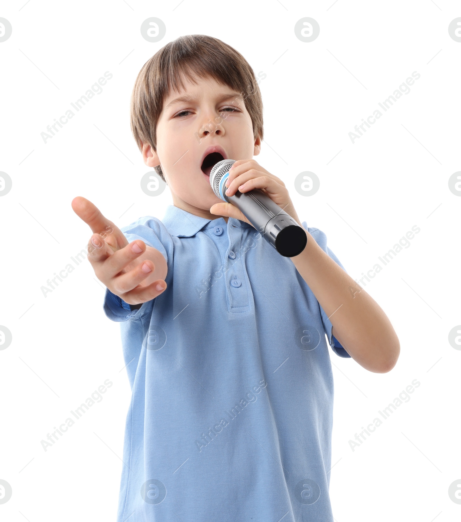 Photo of Cute boy with microphone singing on white background