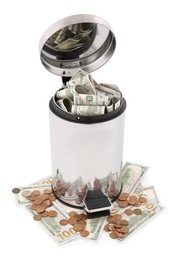 Photo of Dollar banknotes in trash bin and coins on white background