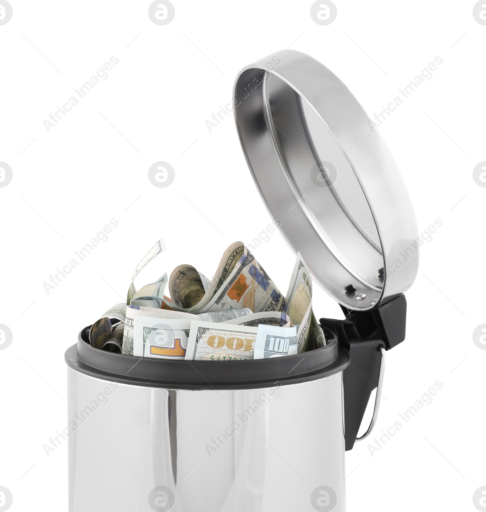 Photo of Dollar banknotes in trash bin on white background