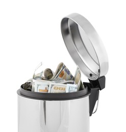 Photo of Dollar banknotes in trash bin on white background