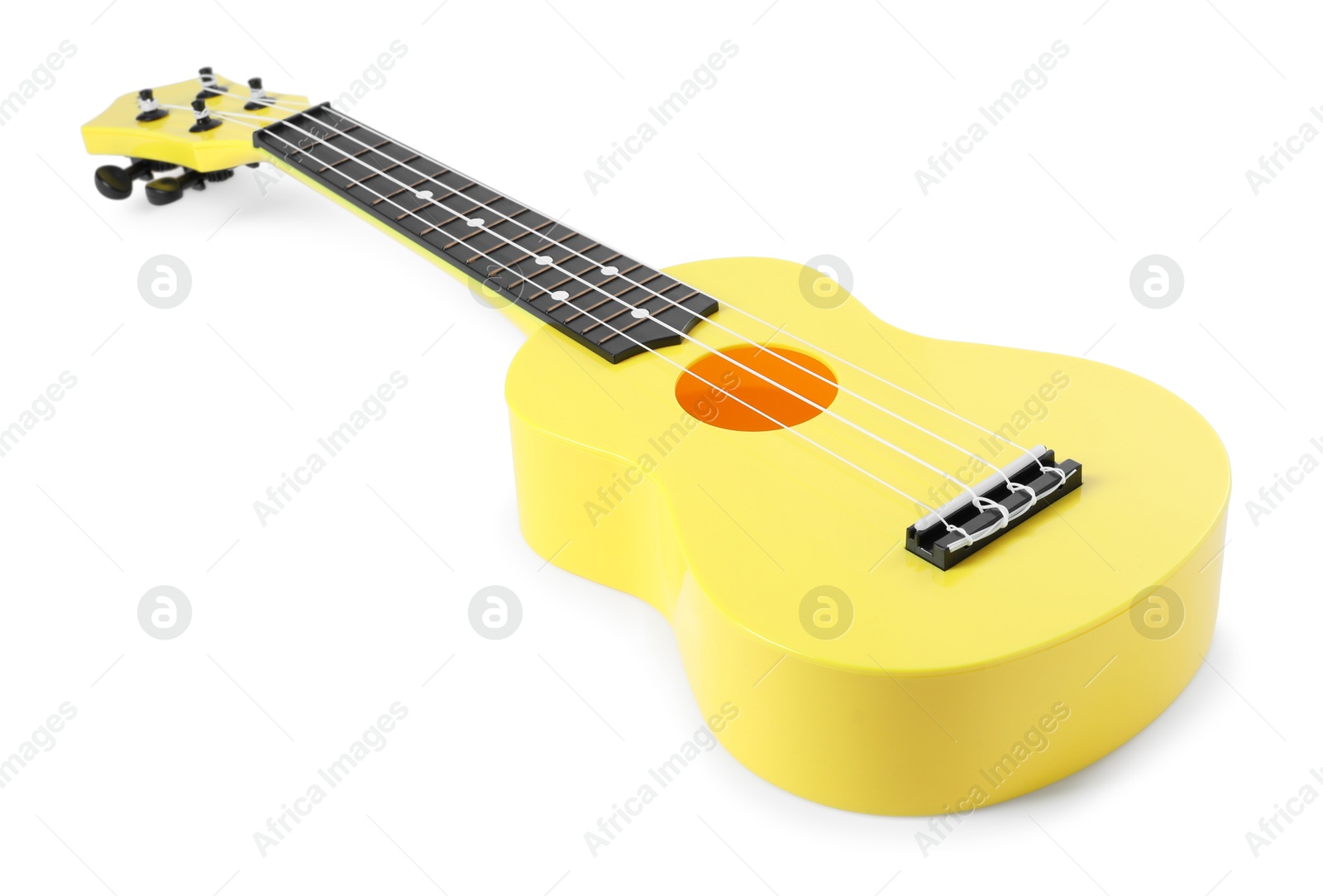 Photo of One ukulele isolated on white. String musical instrument