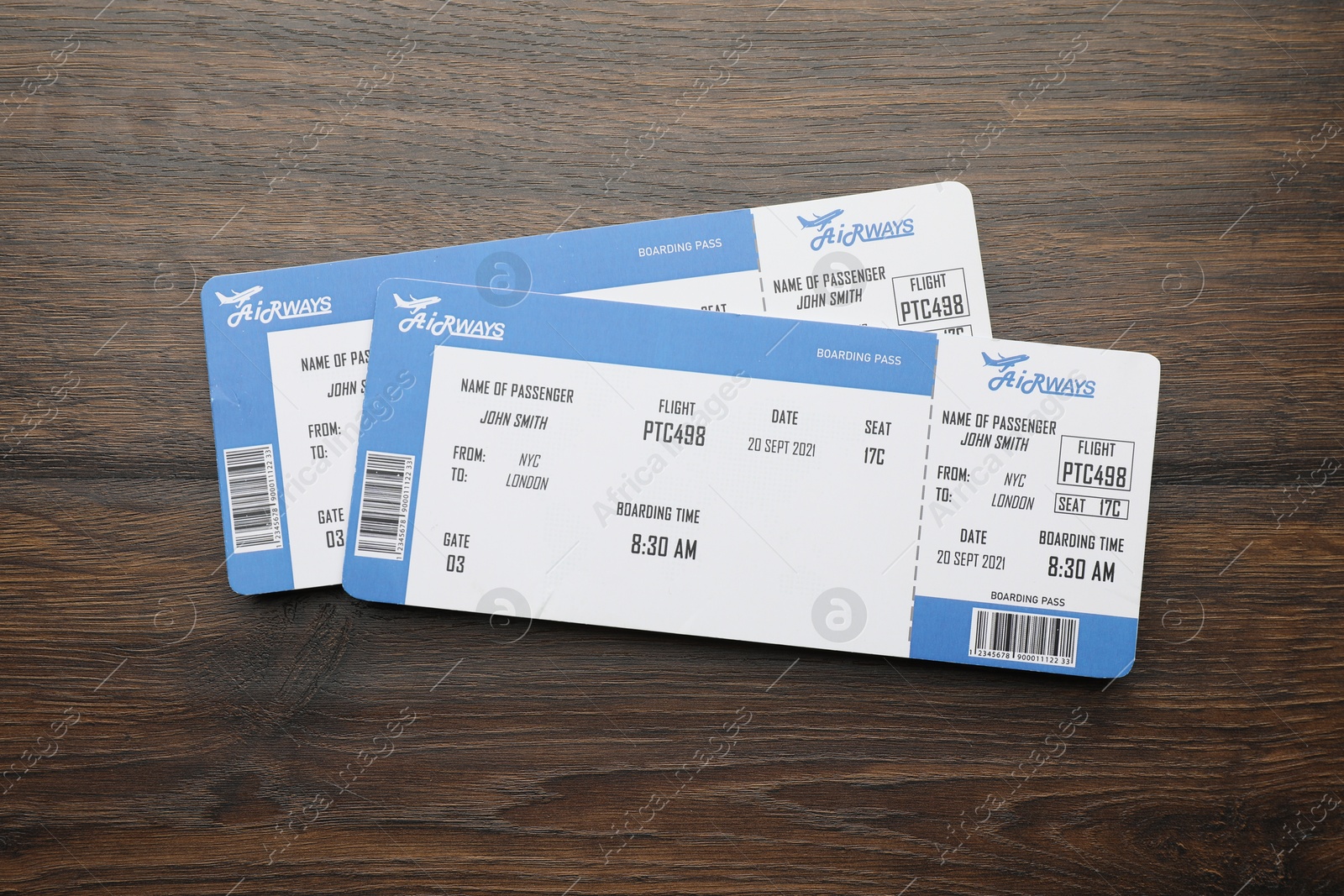 Photo of Travel agency. Flight tickets on wooden table, top view