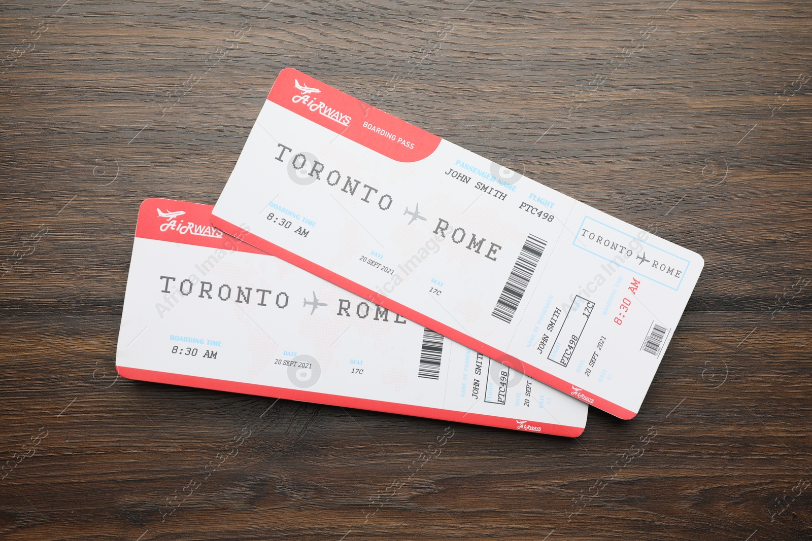 Photo of Travel agency. Flight tickets on wooden table, top view