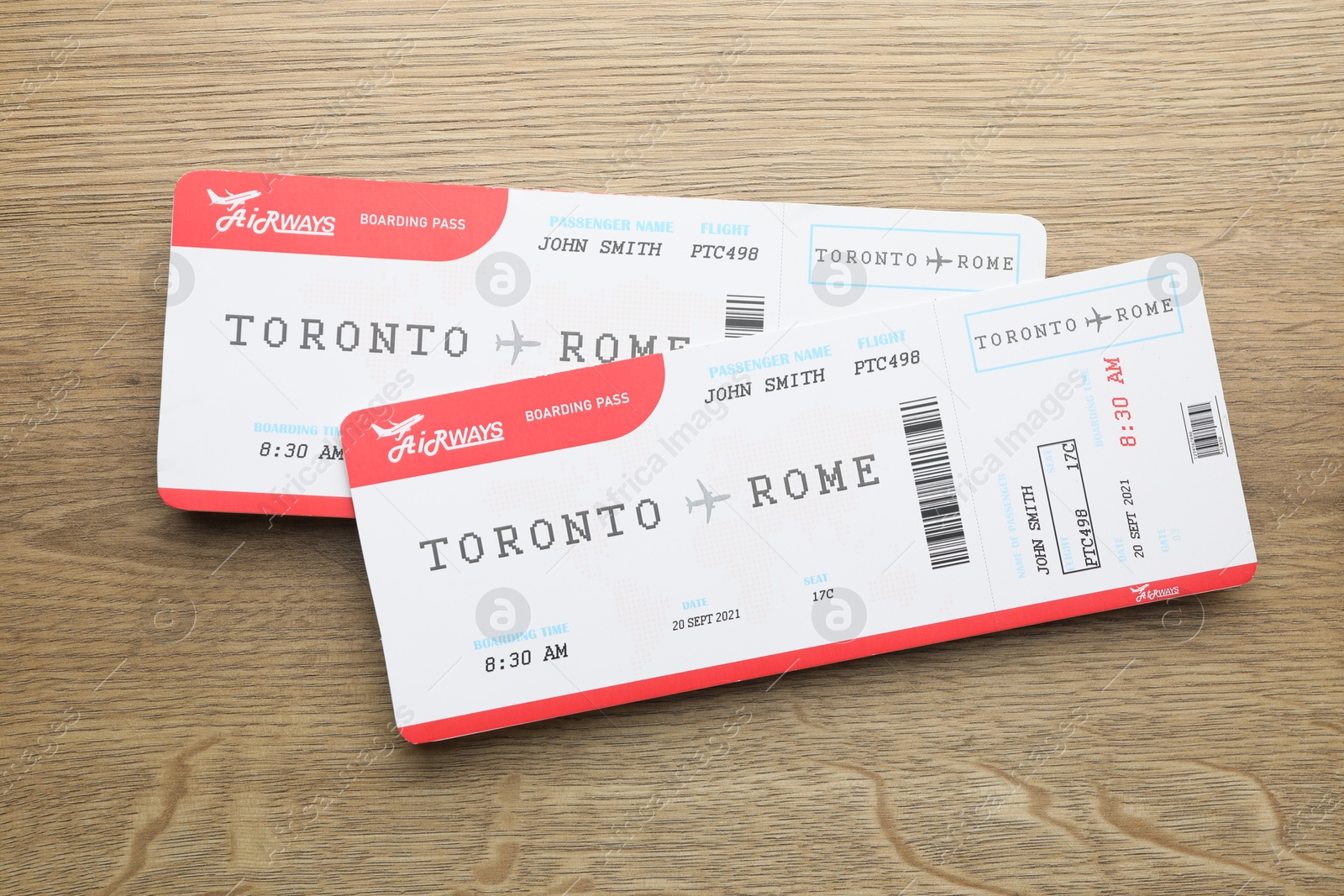 Photo of Travel agency. Flight tickets on wooden table, top view