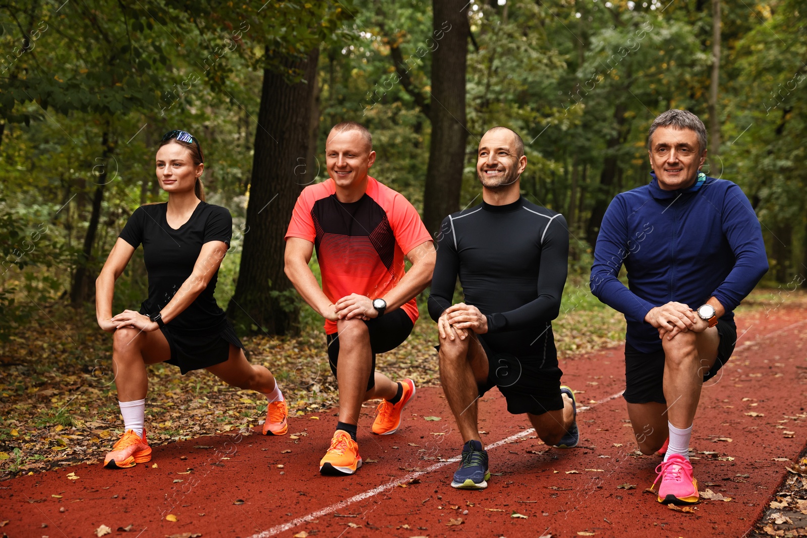 Photo of Group of people stretching in park. Healthy lifestyle