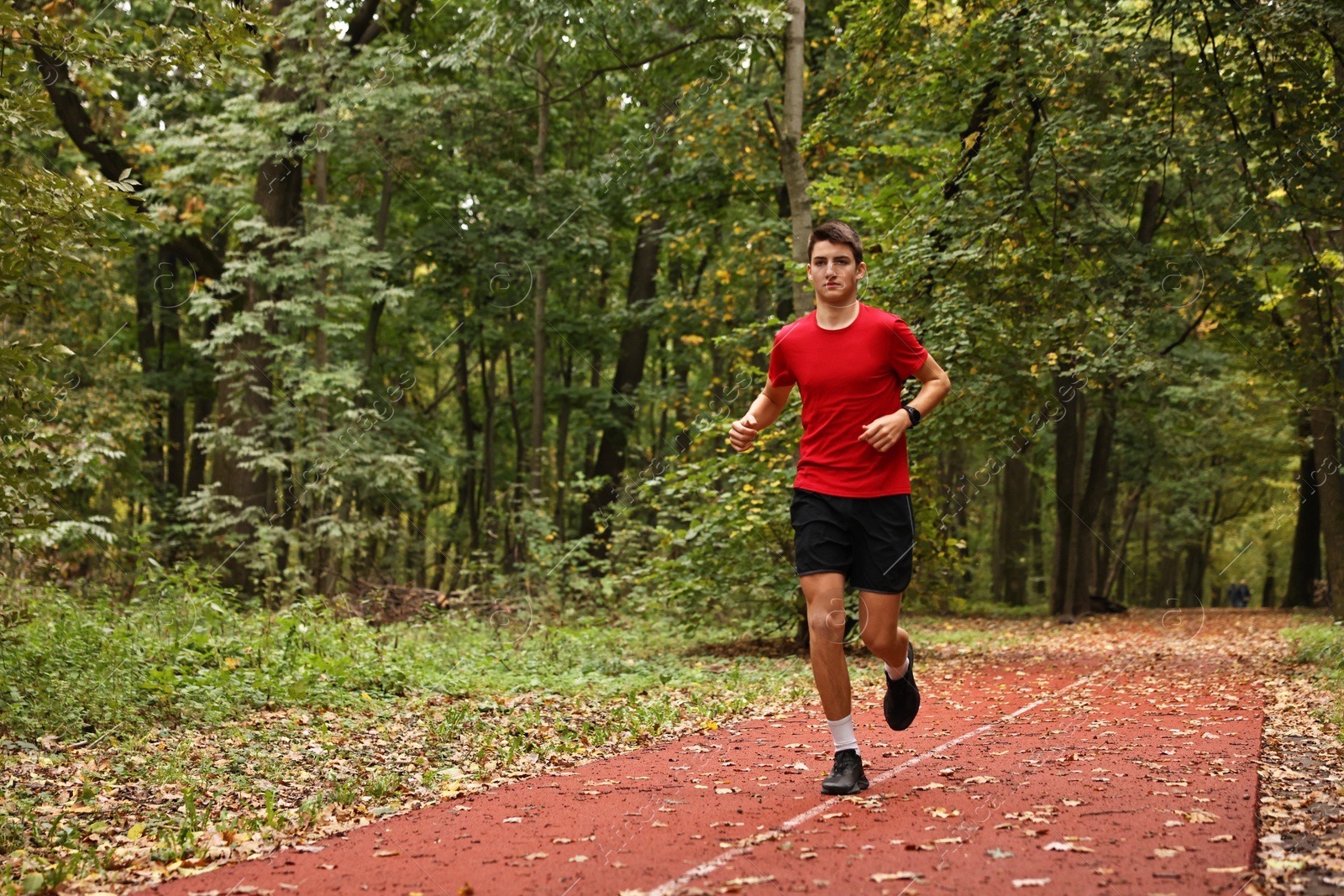 Photo of Athletic man running in park, space for text