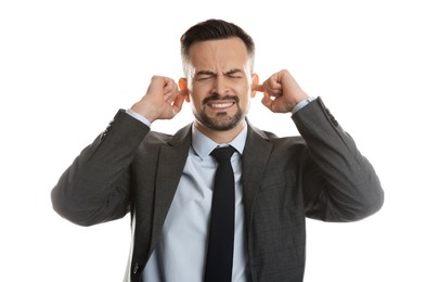 Photo of Man covering his ears with fingers on white background