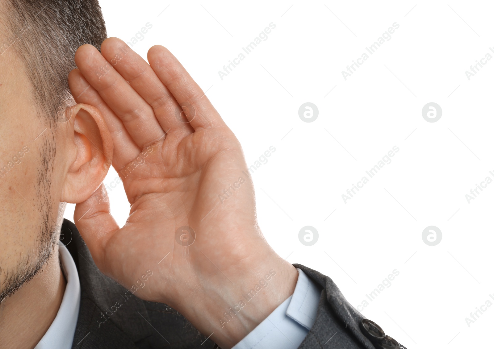 Photo of Man showing hand to ear gesture on white background, closeup