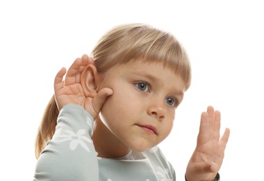 Photo of Little girl showing hand to ear gesture on white background