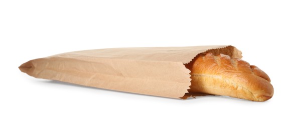 Photo of Freshly baked baguette in paper bag isolated on white