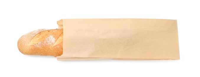 Photo of Freshly baked baguette in paper bag isolated on white, top view