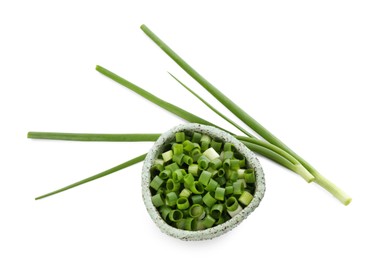 Photo of Fresh green onions isolated on white, top view