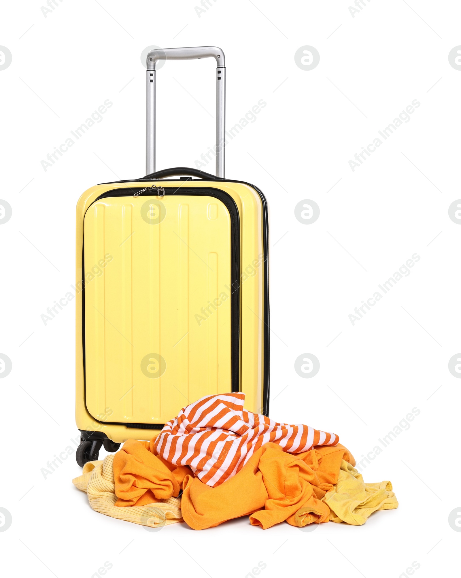 Photo of Suitcase and messy pile of clothes isolated on white