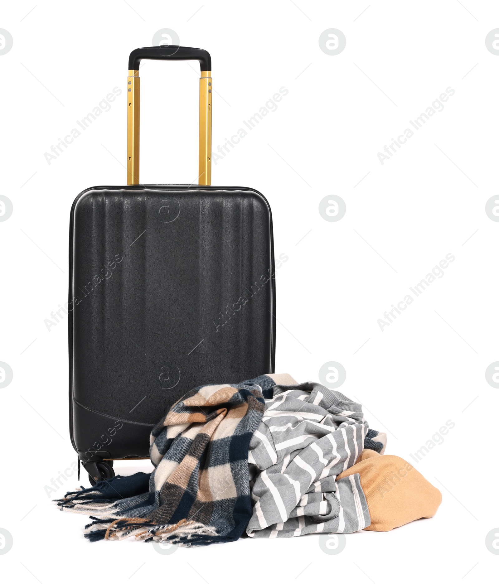 Photo of Suitcase and messy pile of clothes isolated on white