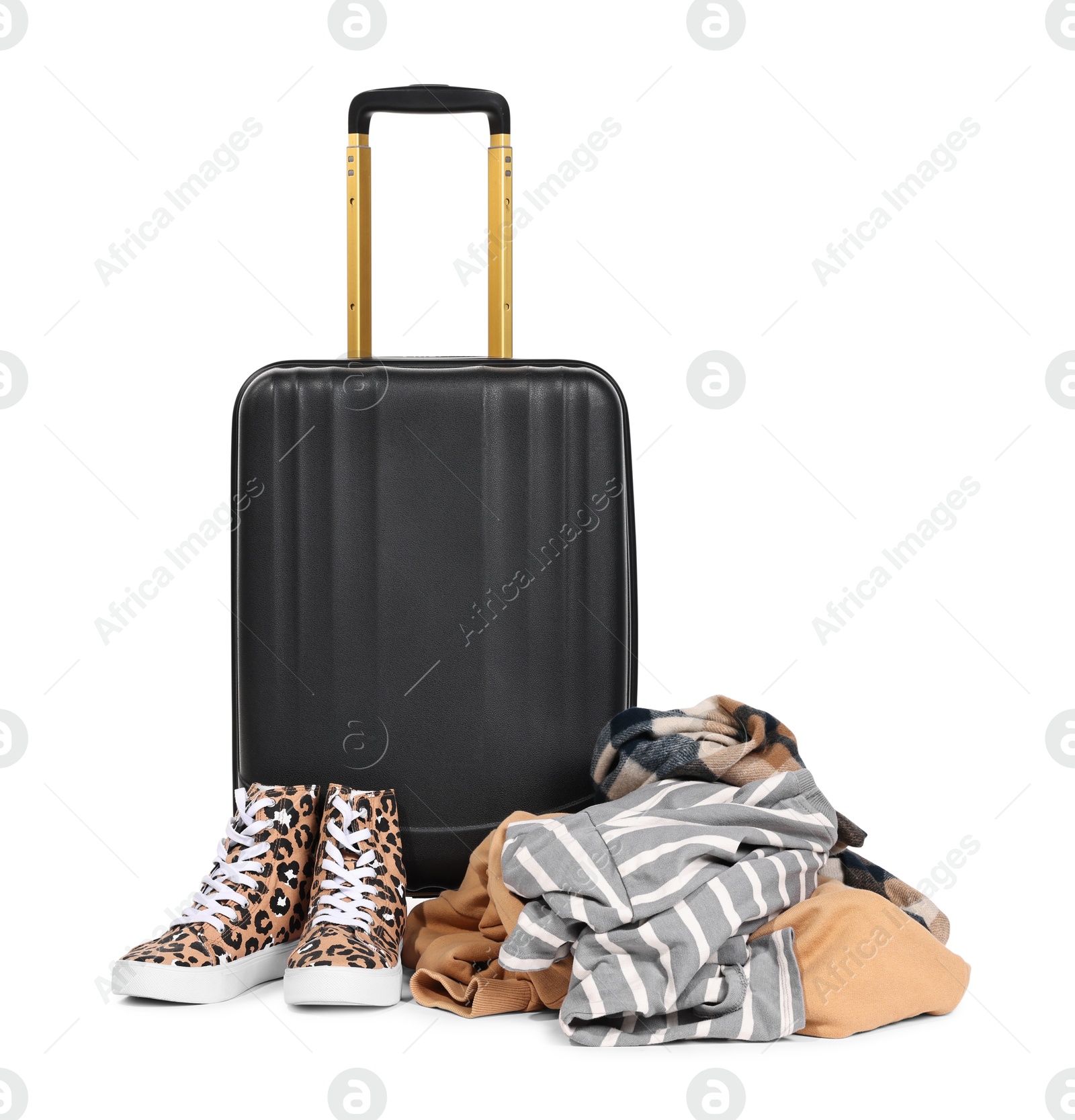 Photo of Suitcase and messy pile of clothes isolated on white