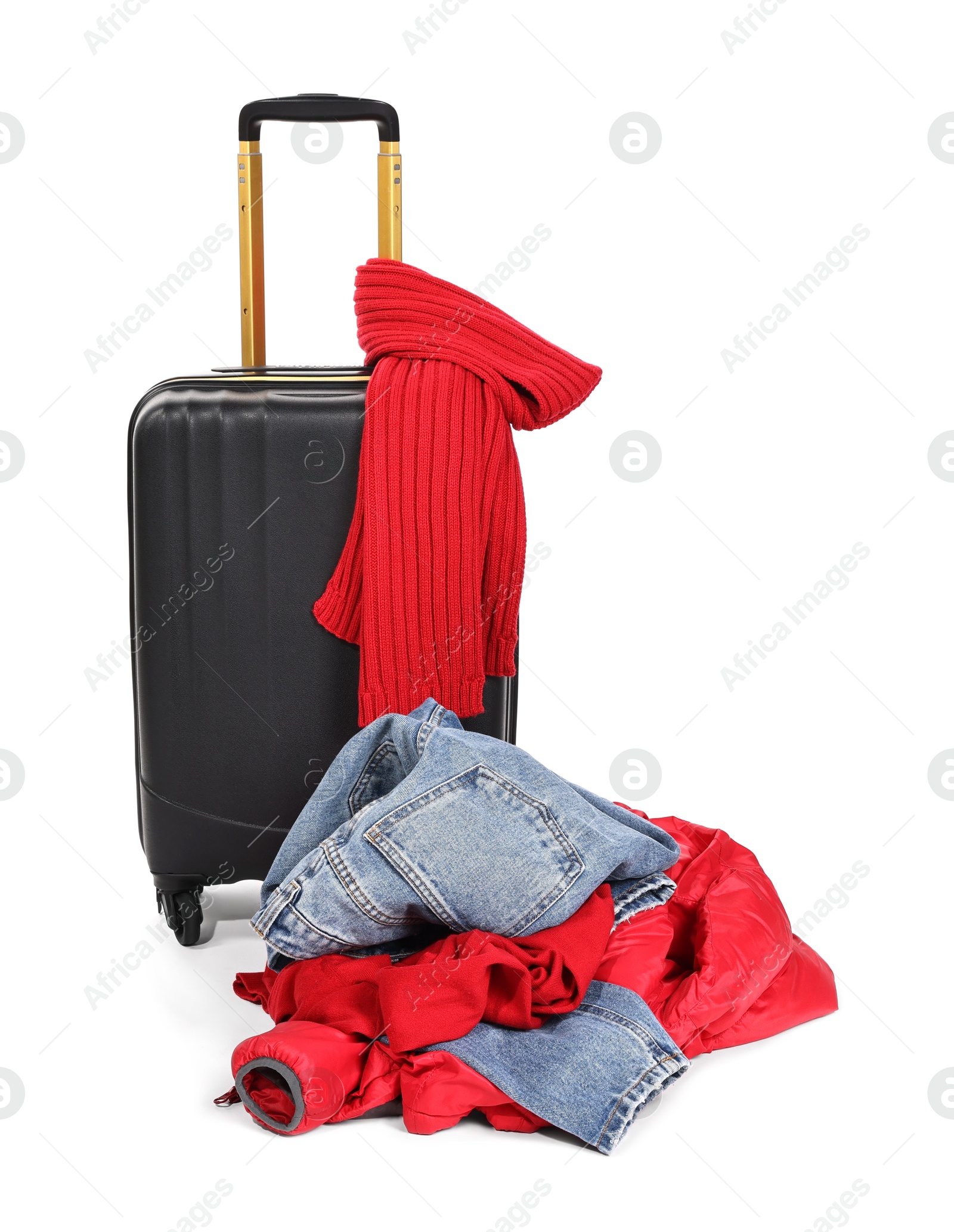 Photo of Suitcase and messy pile of clothes isolated on white