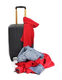 Photo of Suitcase and messy pile of clothes isolated on white