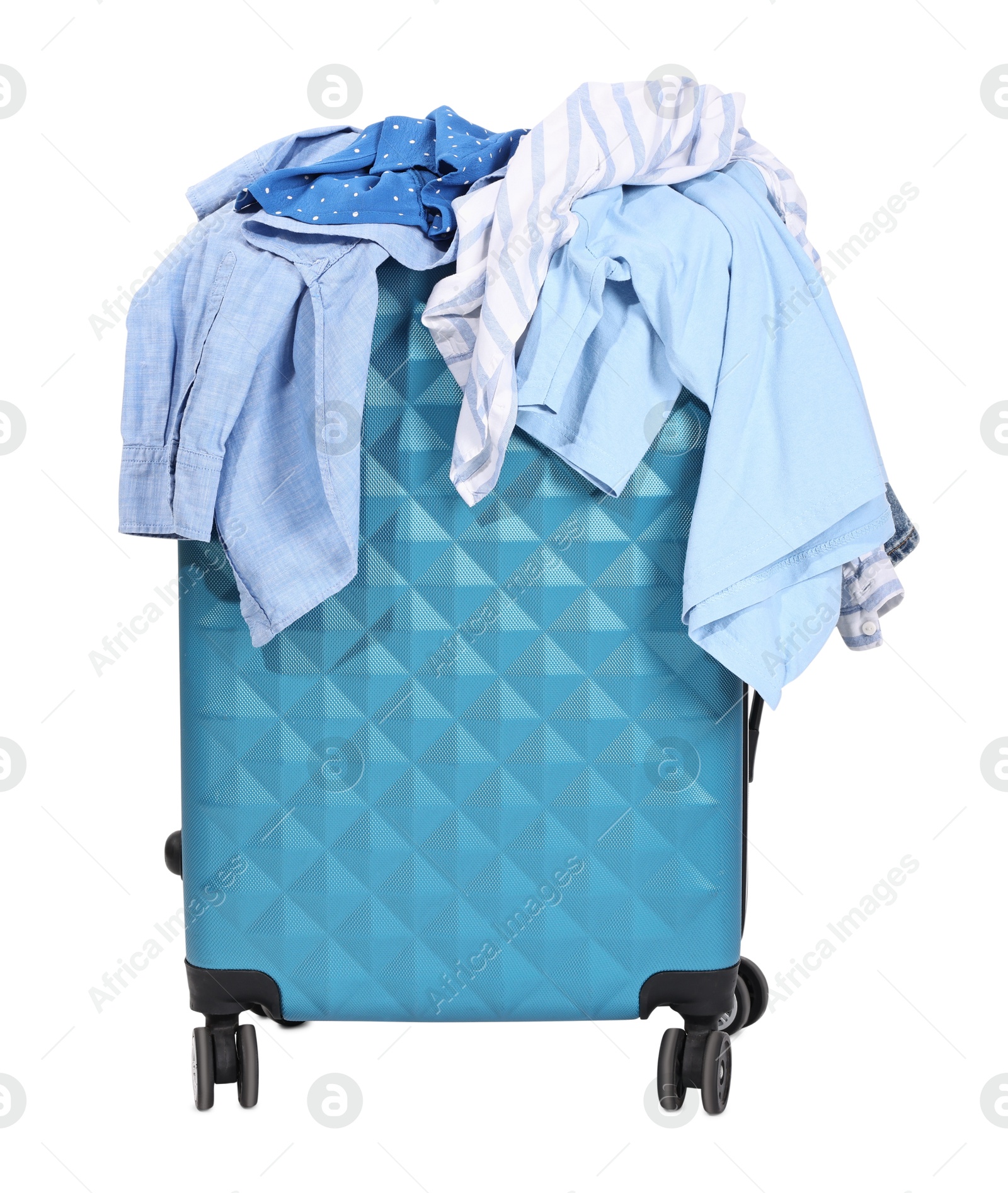 Photo of Packed suitcase full of clothes isolated on white