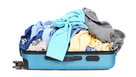 Photo of Packed suitcase full of clothes isolated on white