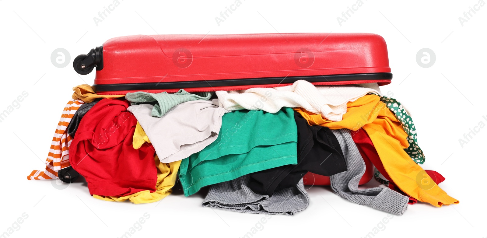 Photo of Packed suitcase full of clothes isolated on white