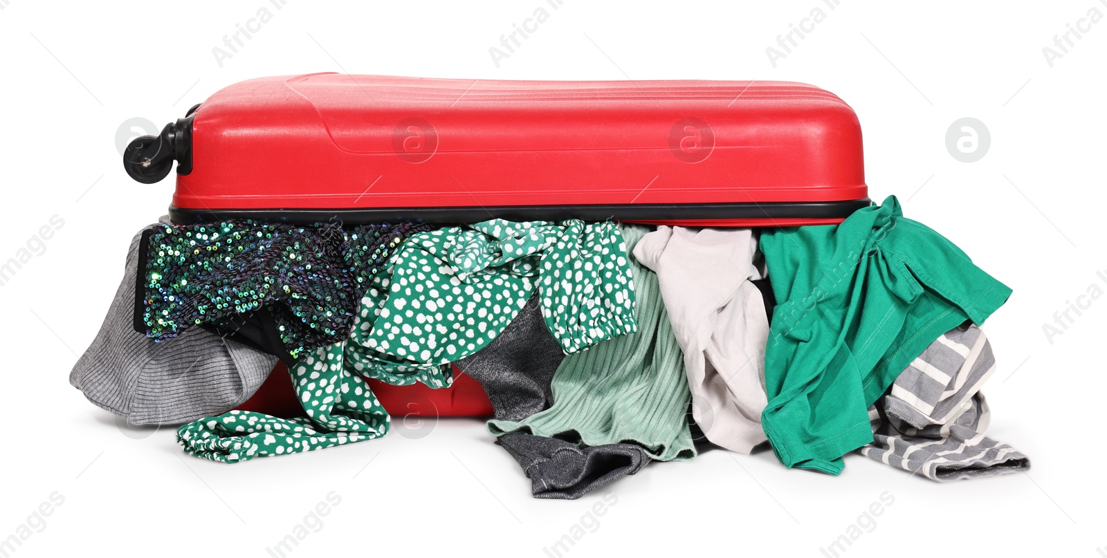 Photo of Packed suitcase full of clothes isolated on white