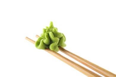 Photo of Chopsticks with hot wasabi paste isolated on white