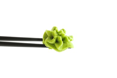 Photo of Chopsticks with hot wasabi paste isolated on white