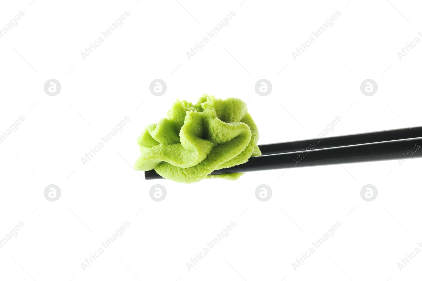 Photo of Chopsticks with hot wasabi paste isolated on white