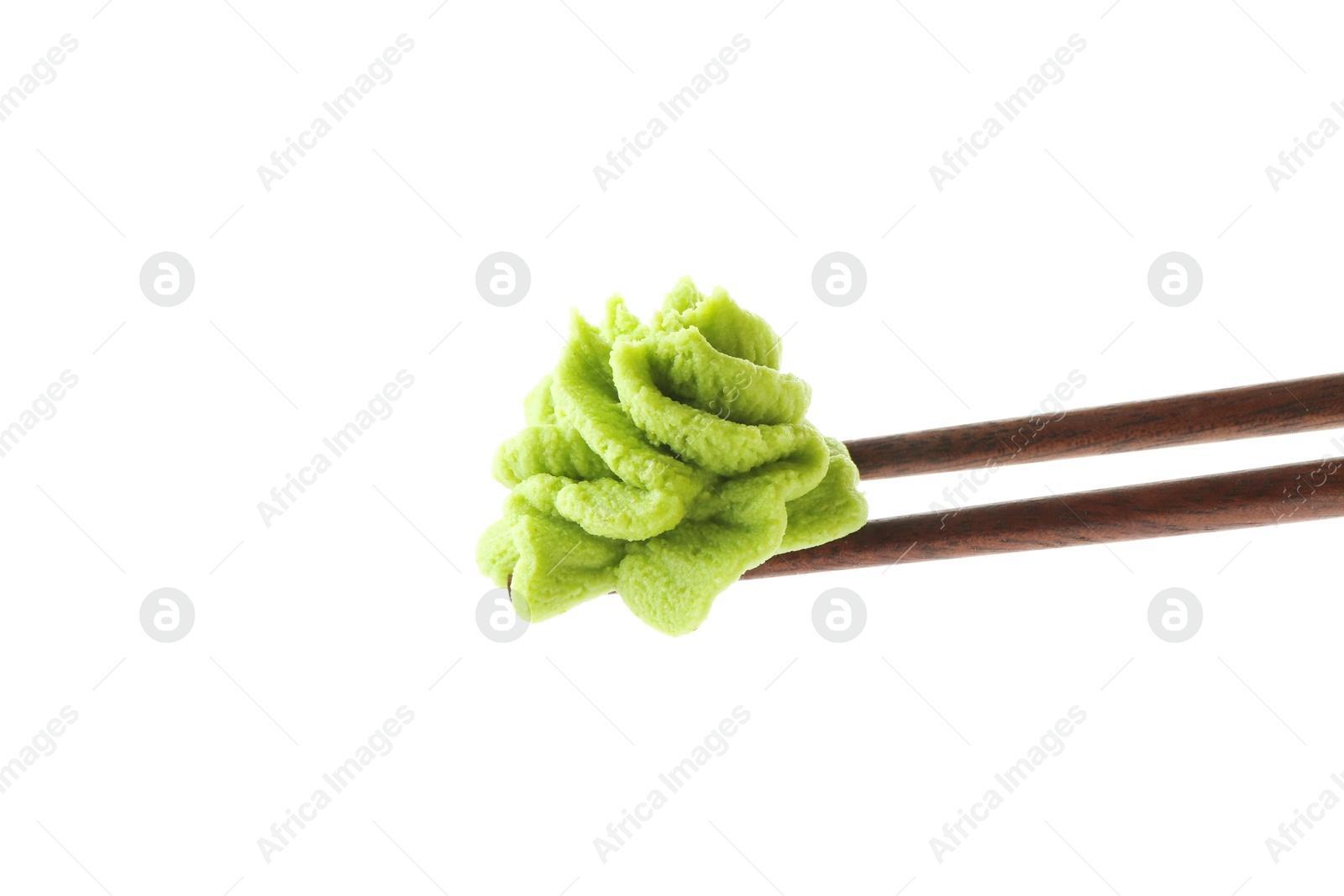 Photo of Chopsticks with hot wasabi paste isolated on white