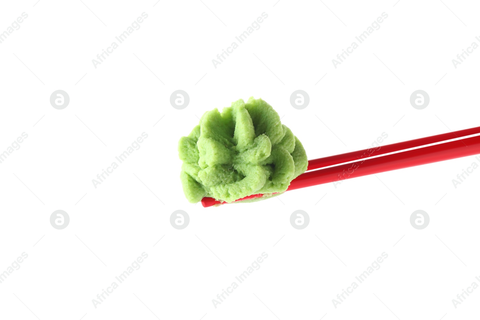 Photo of Chopsticks with hot wasabi paste isolated on white