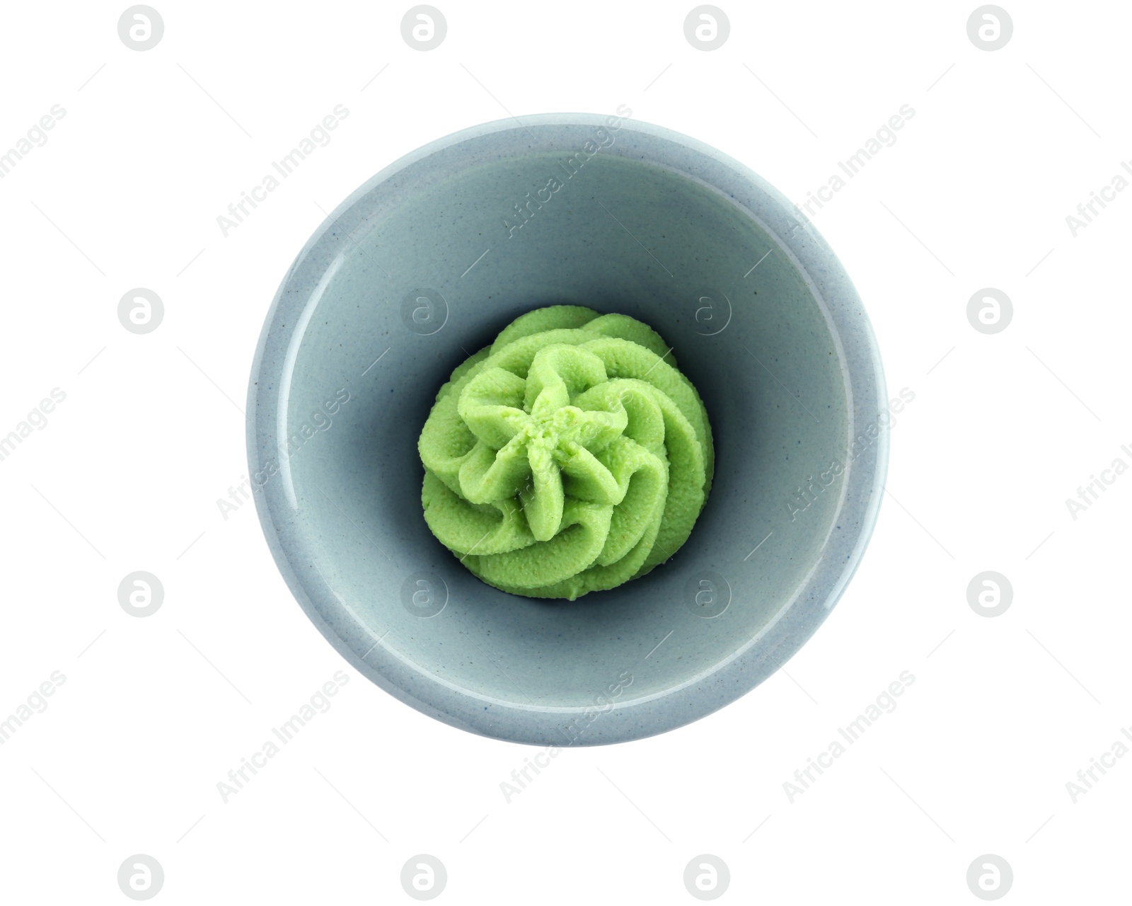 Photo of Hot wasabi paste in bowl isolated on white, top view