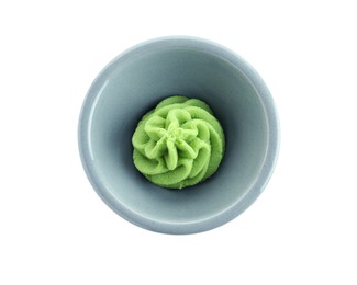 Photo of Hot wasabi paste in bowl isolated on white, top view