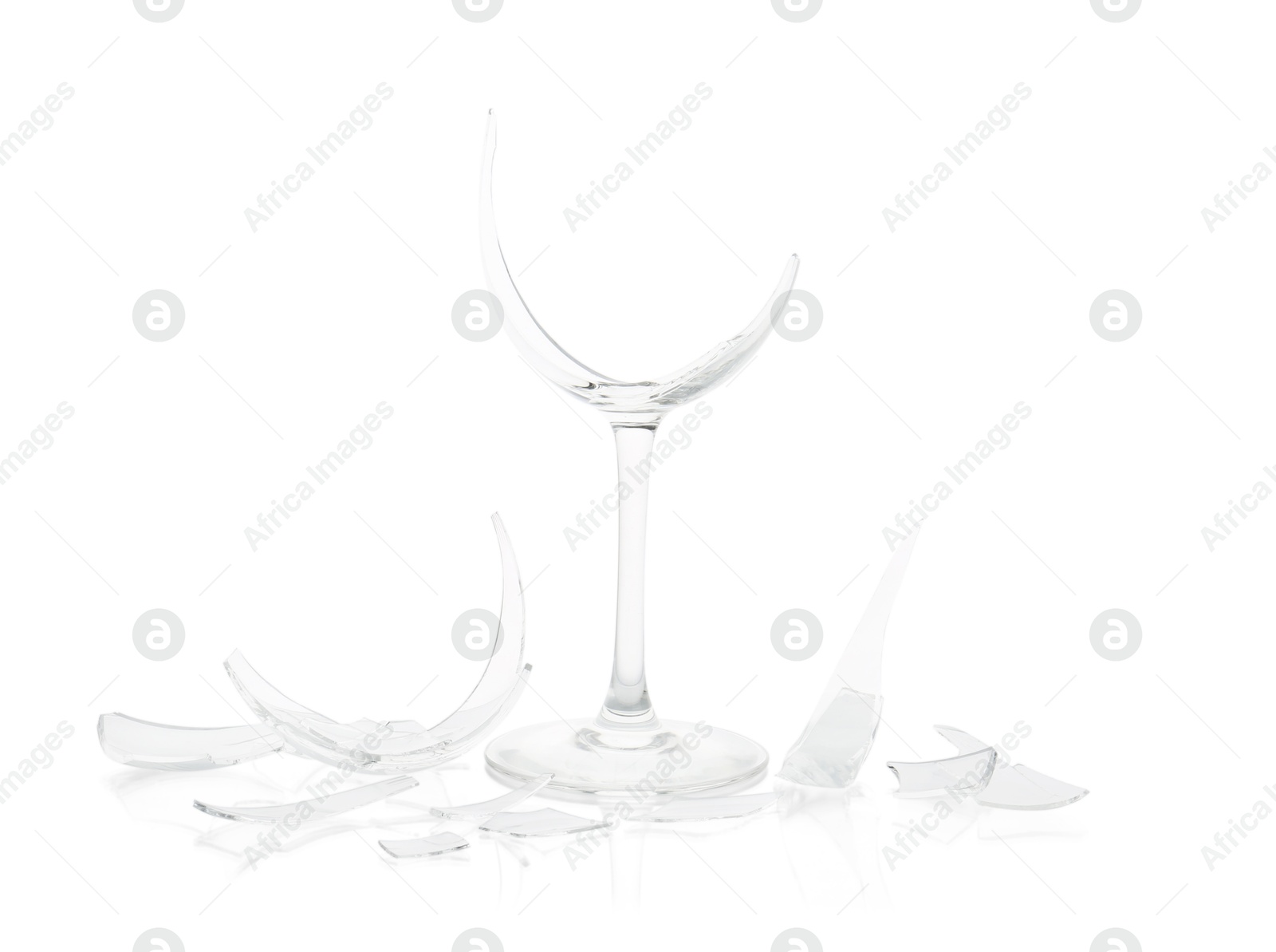 Photo of Pieces of broken wine glass isolated on white