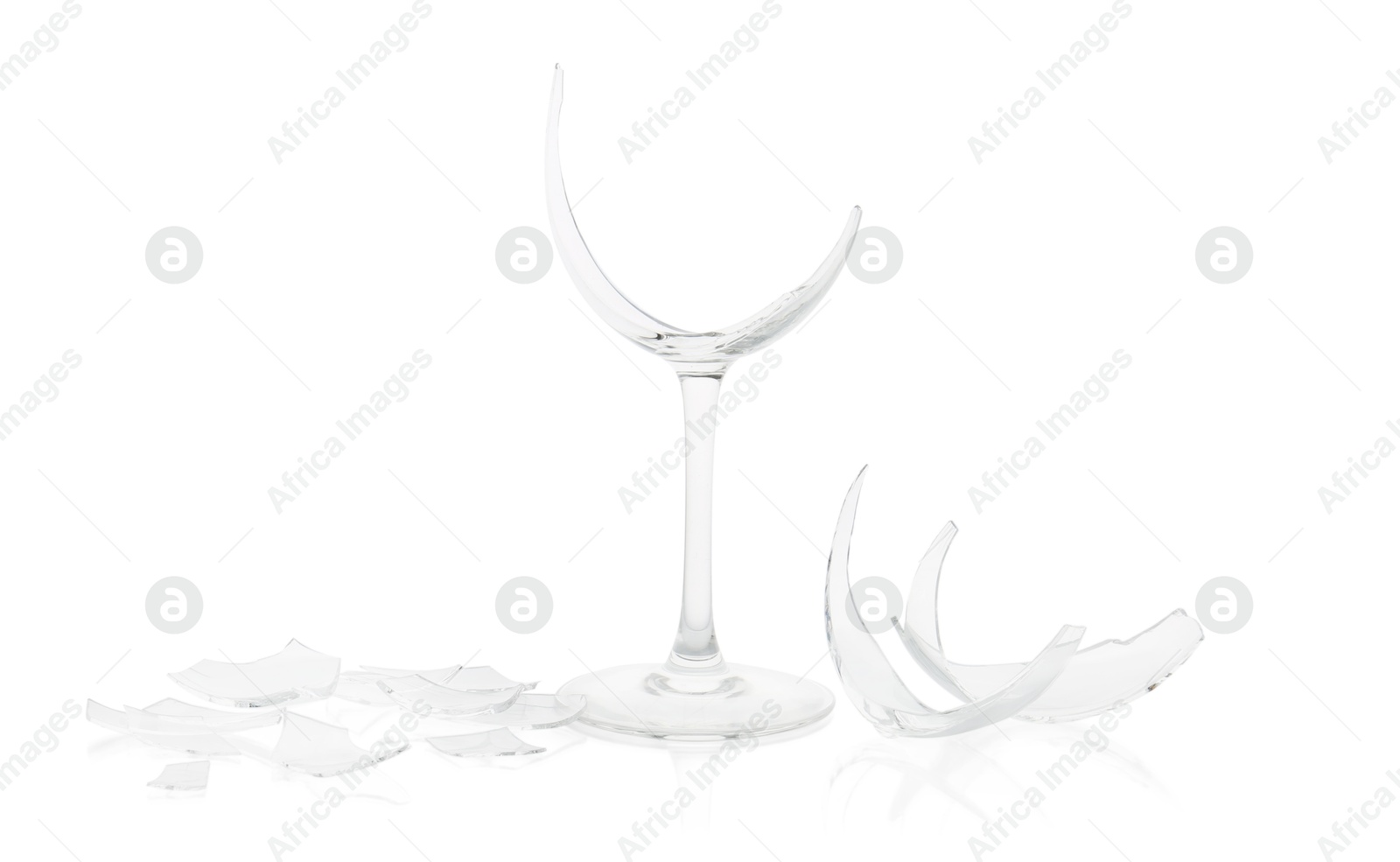 Photo of Pieces of broken wine glass isolated on white