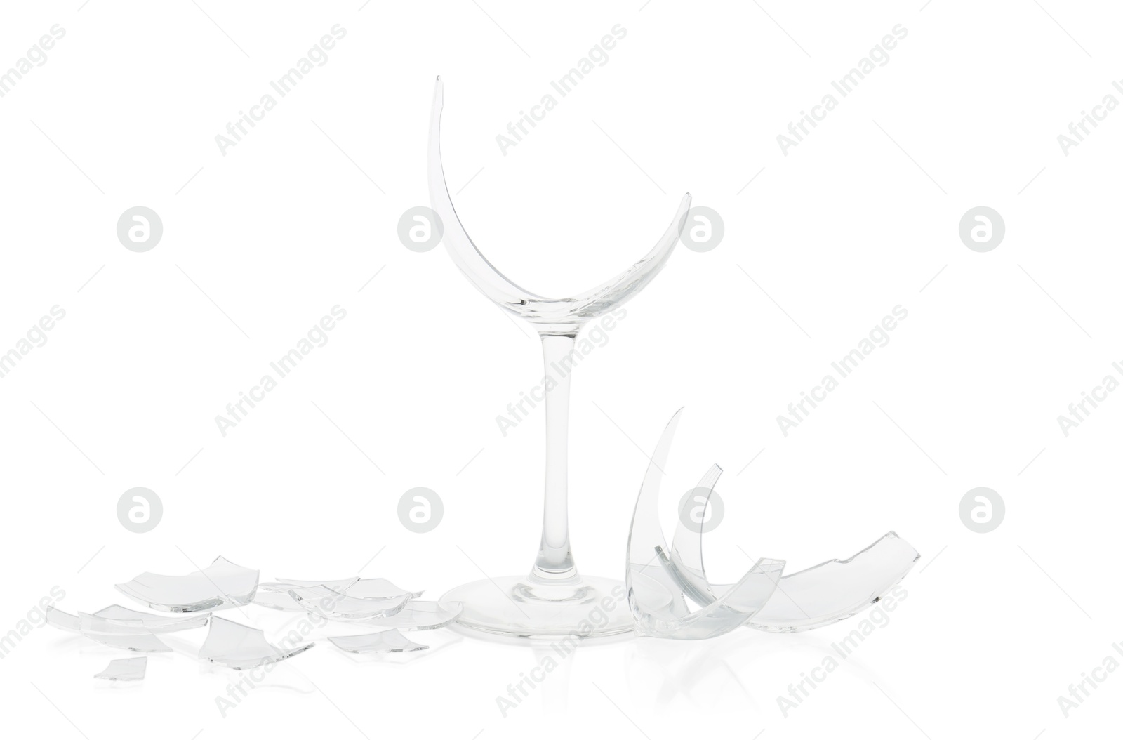 Photo of Pieces of broken wine glass isolated on white