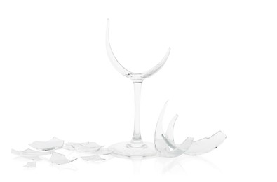 Photo of Pieces of broken wine glass isolated on white