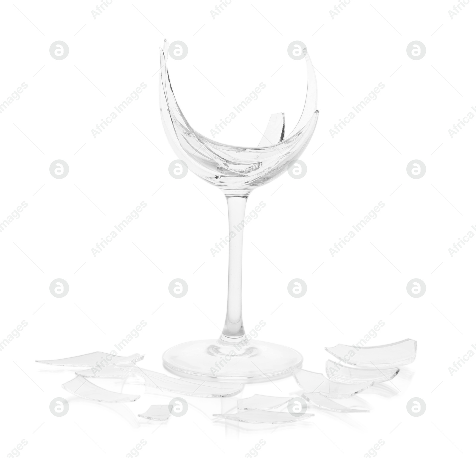 Photo of Pieces of broken wine glass isolated on white