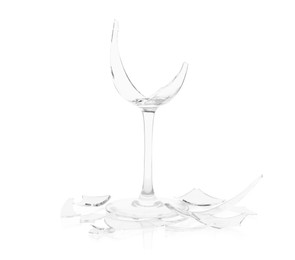 Photo of Pieces of broken wine glass isolated on white