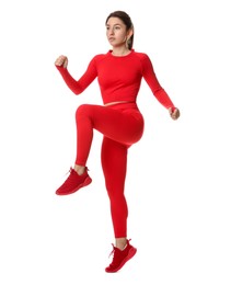 Woman in sportswear exercising on white background