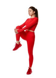 Photo of Woman in sportswear exercising on white background