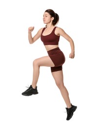 Woman in sportswear exercising on white background