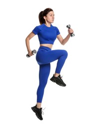 Photo of Woman in sportswear exercising with dumbbells on white background