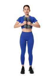 Photo of Woman in sportswear exercising with dumbbells on white background