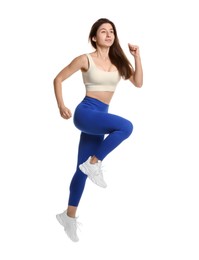 Woman in sportswear exercising on white background