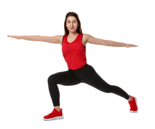 Photo of Woman in sportswear exercising on white background