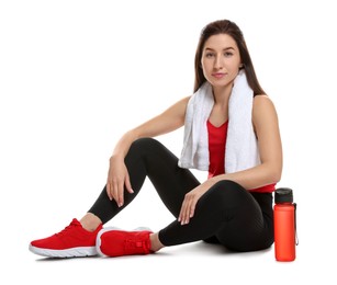 Photo of Woman in sportswear with bottle of water on white background