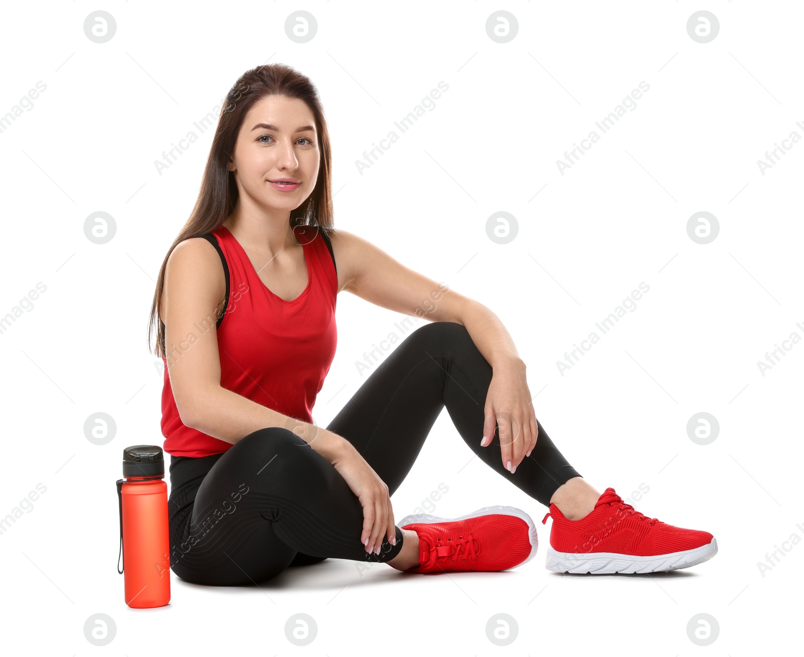 Photo of Woman in sportswear with bottle of water on white background